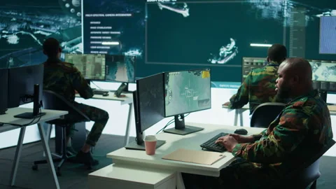 Army intelligence specialists using advanced computer systems and satellite data Stock Footage 280148449