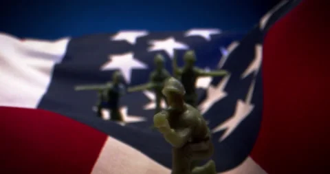 Army Men on American Flag in Macro Slow Motion Stock Footage 134090665