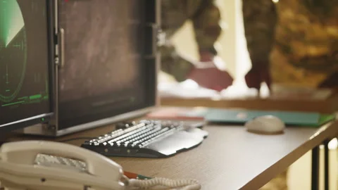 Army officers developing operation plan using topographic map in control room Stock Footage 335539485