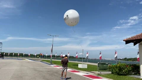 Army Open House Balloon along F1 track Stock Footage 195967006