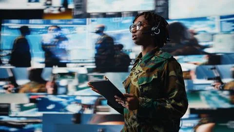 Army operator communicating enemy activity to ground troops Stock Photos