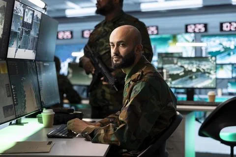 Army operator tracking target information on digital screens Stock Photos
