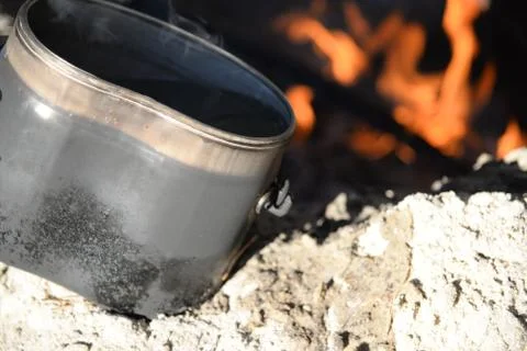 Army pot on a background of fire Stock Photos