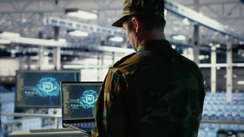 Army programmer in high tech server hub uses AI application on laptop Stock-Footage 314686482
