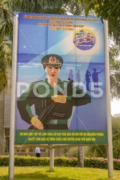 Army propaganda poster in Ho Chi Minh City Vietnam Stock Photos