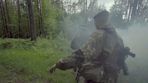 Army recruits doing basic training for a platoon attacking a battlefield with a Stock Footage 206683943