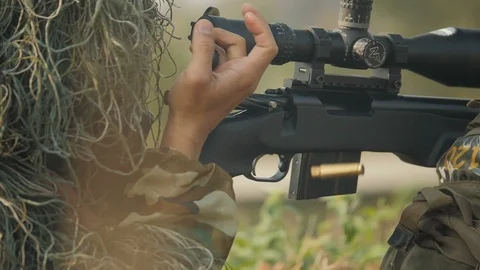 Sniper reload his rifle in forest Stock Photo by ©Nesterenko_Max 89103288