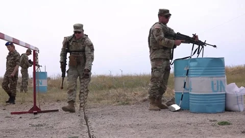 Army soldier dragging stinger from checkpoint on dirt road  Video stock 279968415