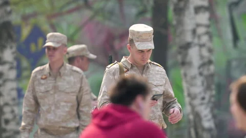 Army soldier write message. Armed man send sms. War force. Military mobile phone Stock Footage 243252418
