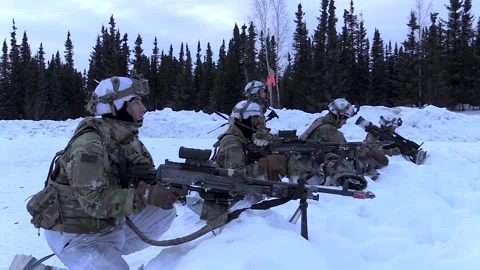 Army soldiers keep lookout with machine guns from defensive fighting position Stock Footage 237603593