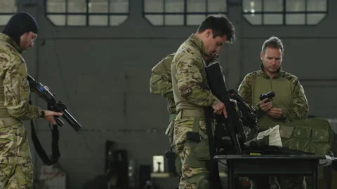 Army soldiers loading and checking weapons Stock Footage 275093782