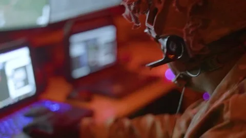 Army soldiers utilize laptop computers inside Stryker vehicle onboard C-17 Stock Footage 257770110