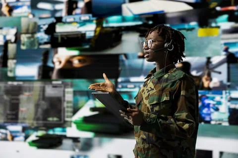 Army telecommunication systems operator using satellite software on tablet Stock Photos
