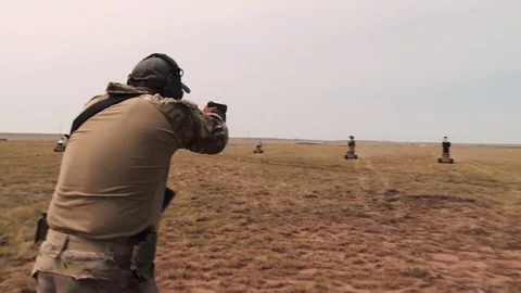 Army units use moving targets for gun practice in this anti terrorism Stock Footage