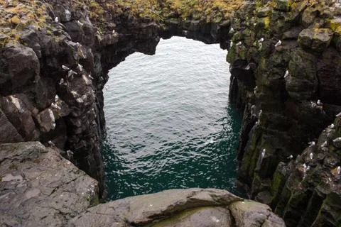 Arnarstapi basalt rock arch formation, Iceland Stock Photos