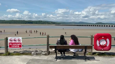 Arnside, UK 19 June 2024; River Kent Estuary, Pier and sands at low tide Stock Footage 277796909