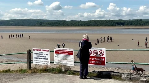 ARNSIDE, UK 19 June 2024; River Kent Estuary, Pier and sands at low tide Stock Footage 277796961