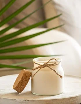 Aroma candle on table, decor elements, spa and relax concept, free space for Stock Photos