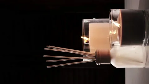 Aroma diffuser and scented candles that create coziness in the house.  Video stock 219619763