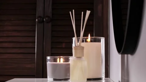 Aroma diffuser and scented candles that create coziness in the house Stock Footage 219830549