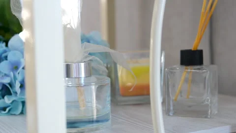 Aroma diffuser. Aroma scented reed diffuser glass is on the tray with scented Stock Footage 278206534