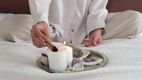 Aroma diffuser, burning candles on a metal tray on the windowsill Video stock 268799940