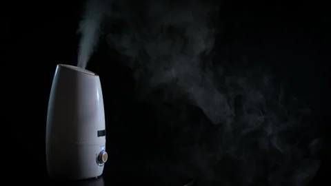 Aroma diffuser steam against black background. Video stock 279514813