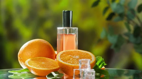 Aroma oil close-up. Spray diffuser and oranges on nature background. Perfume for Stock-Footage 166579344