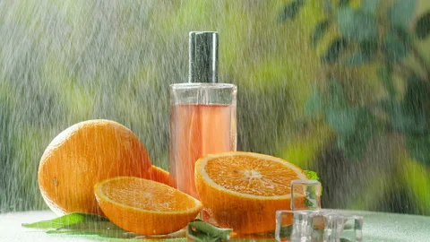 Aroma oil close-up. Spray diffuser and oranges on nature background. Perfume for Stock-Footage 166581488