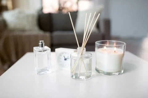Aroma reed diffuser, burning candle and perfume Stock Photos