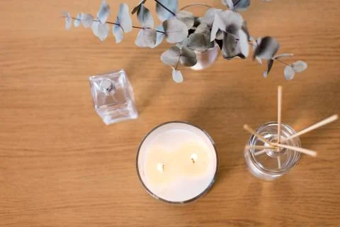 Aroma reed diffuser, burning candle and perfume Stock Photos