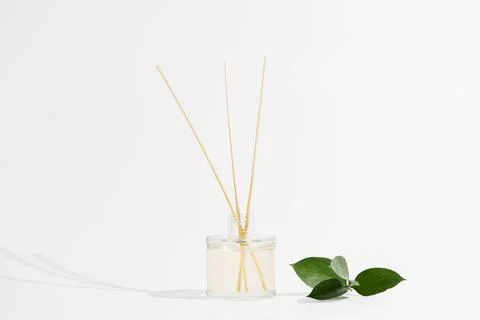 Aroma reed diffuser transparent glass jar with smell of freshness and flowe.. Stock Photos