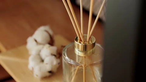 Aroma reed diffuser on wooden shelf Stock Footage 138513277