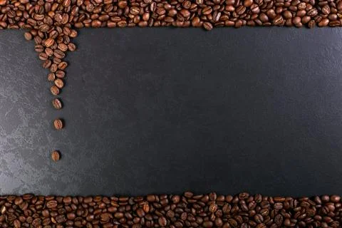 Aroma roasted coffee beans on rustic tabletop, brown banner background. Stock Photos