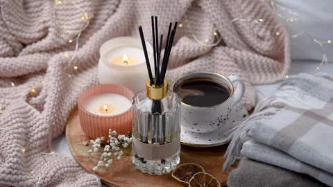 Aroma scented reed diffuser glass is on the tray with scented candle Stock Footage 263014051