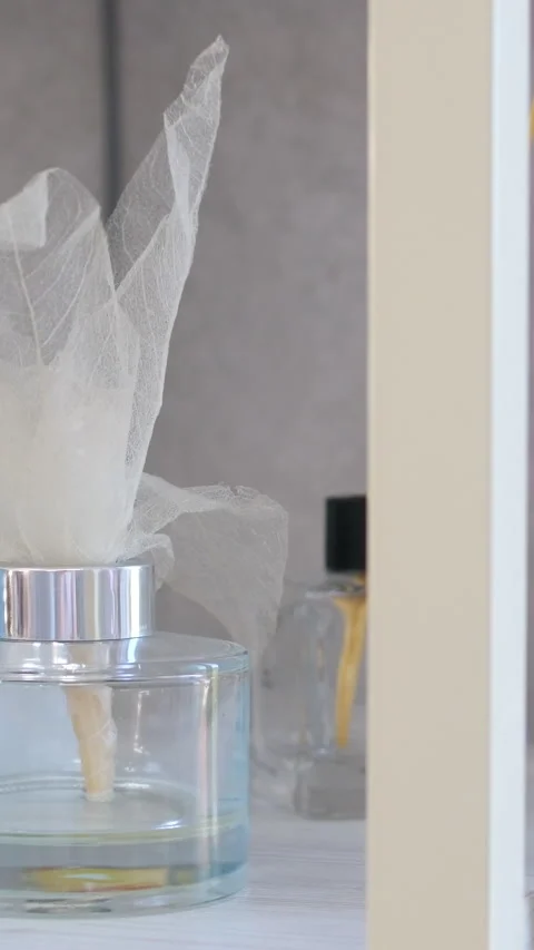 Aroma scented reed diffuser glass is on the tray with scented Perfume flavor Stock Footage 278581744