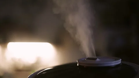 Aromatherapy diffuser for the room stands on the table. Stock Footage 325337093