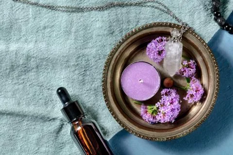 Aromatherapy flat lay with copy space. Essential oil bottle, a candle, a vial Foto stock