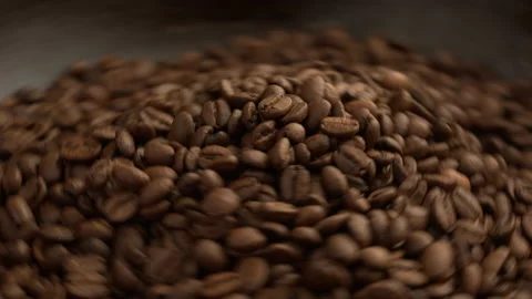 Aromatic and roasted coffee beans rotate on the roaster. Mix the aromatic coffee Video stock 136663987