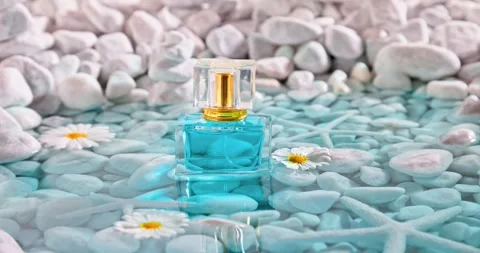 Aromatic blue perfume in environment of white stones and sea. Stock-Footage 337072629
