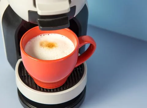 Aromatic cappuccino from a capsule coffee machine Stock Photos