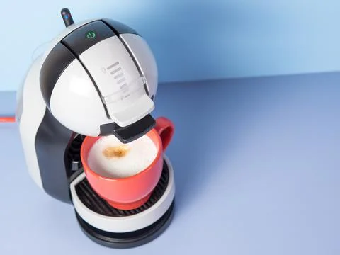 Aromatic cappuccino from a capsule coffee machine Stock Photos