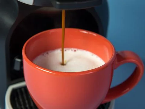 Aromatic cappuccino from a capsule coffee machine Stock Photos