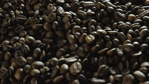 Aromatic coffee beans are roasted. Roasted coffee beans are rotating. Stock Footage 140224241