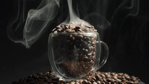 Aromatic coffee beans in a cup and rotation. heap of coffee beans with smoke Video stock 263922595