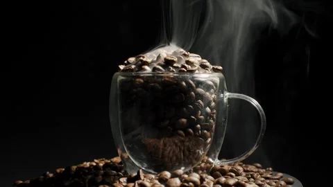Aromatic coffee beans in a cup and rotation. heap of coffee beans with smoke Video stock 271332667