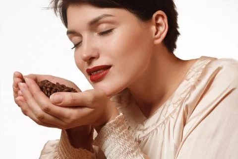 Aromatic coffee beans in hands Foto stock