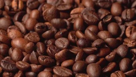 Aromatic coffee beans lie before making coffee, coffee beans fall Stock Footage 150512049