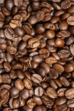 Aromatic coffee beans surface rich brown. Stock Photos