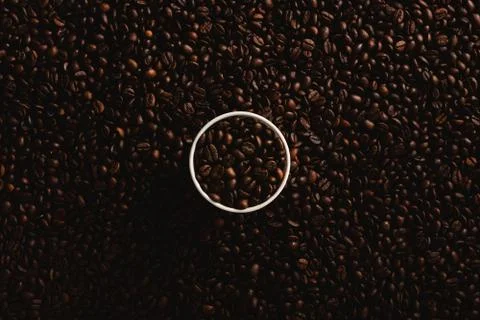 Aromatic coffee cup background on coffee beans Stock Photos